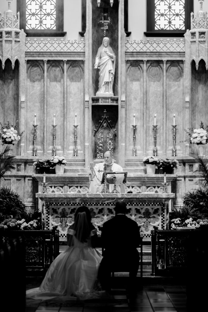 A priest at the altar for a Loudoun County wedding ceremony
