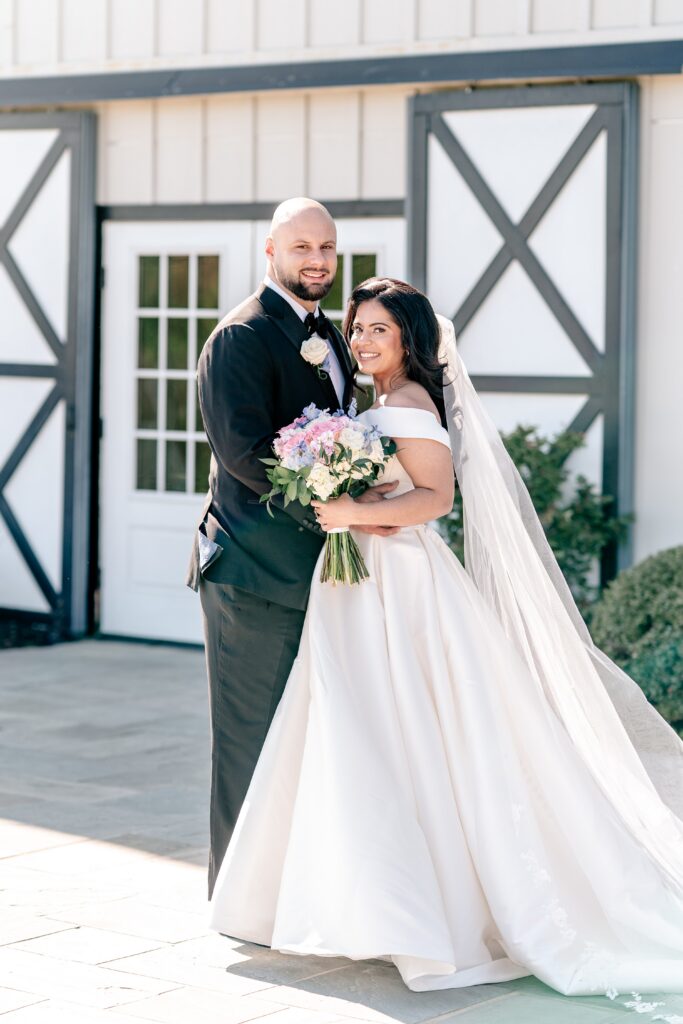A bride and groom smiling for their Northern VA wedding photographer
