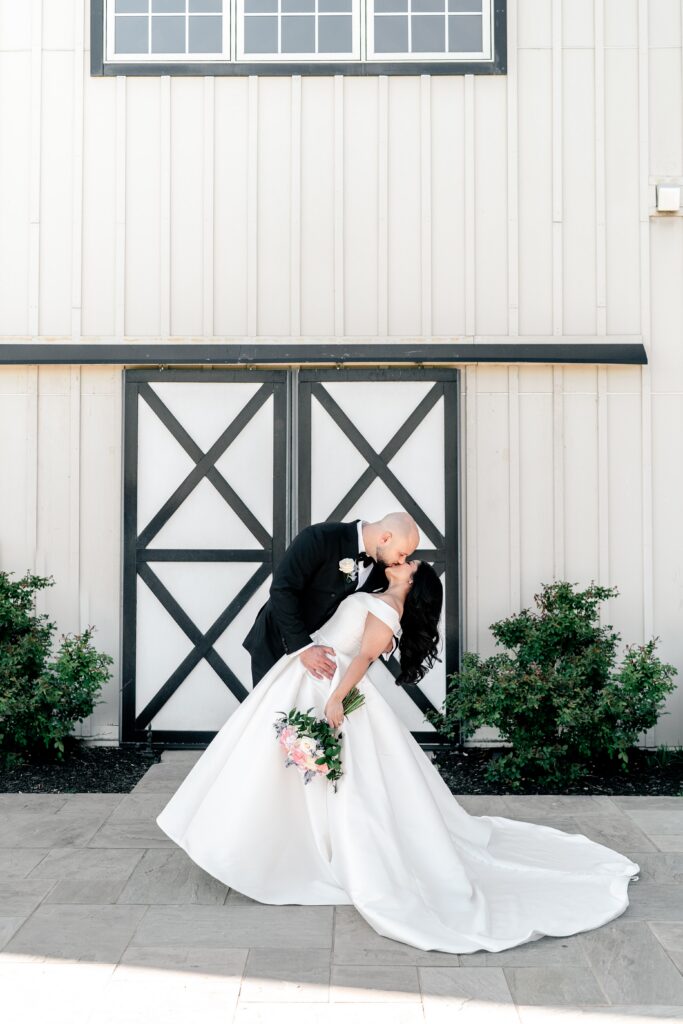 A romantic dip kiss during a Loudoun County wedding