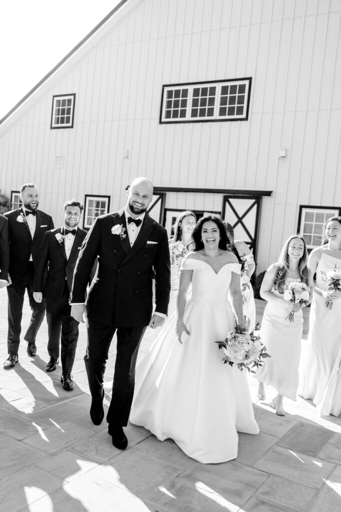 A wedding party walking together across the patio for a Shadow Creek wedding