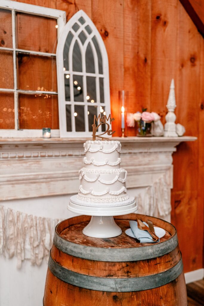 A classic white buttercream cake at a barn wedding in Loudoun County