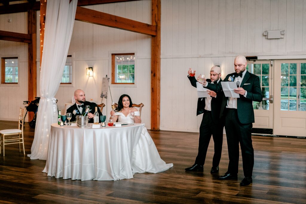 Groomsmen toasting to the bride and groom at a Loudoun County wedding