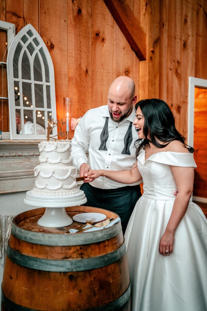 Cutting the cake during a Shadow Creek wedding reception