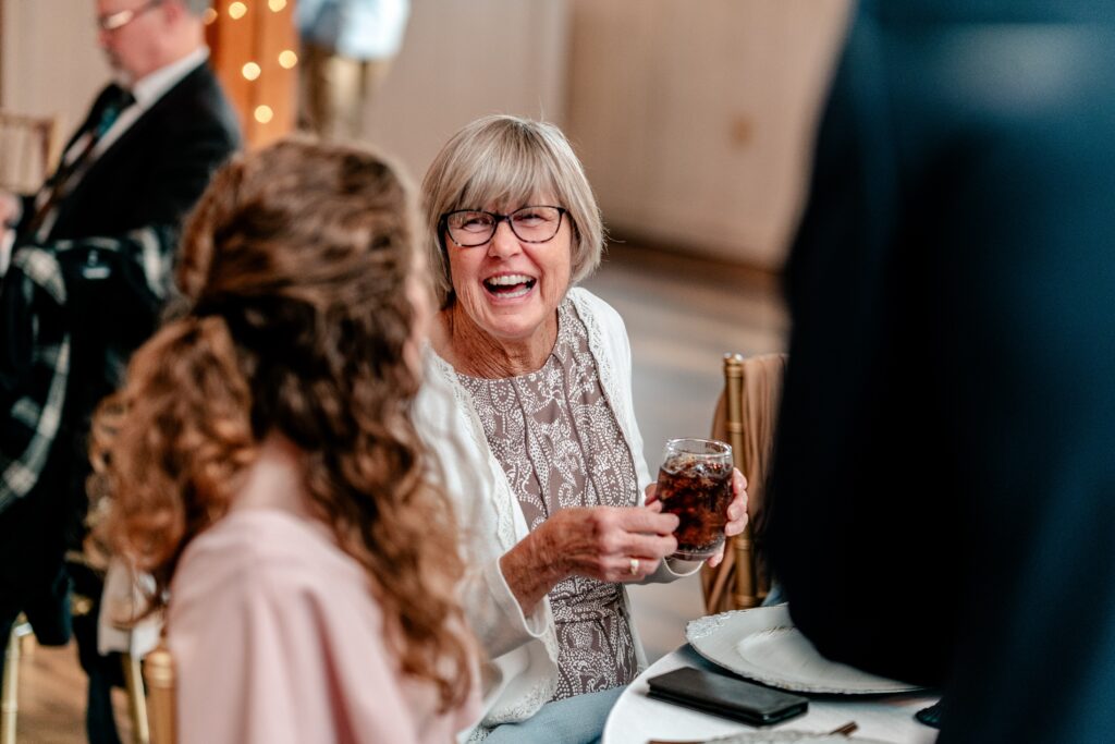 A guest laughing during dinner for a Loudoun County wedding
