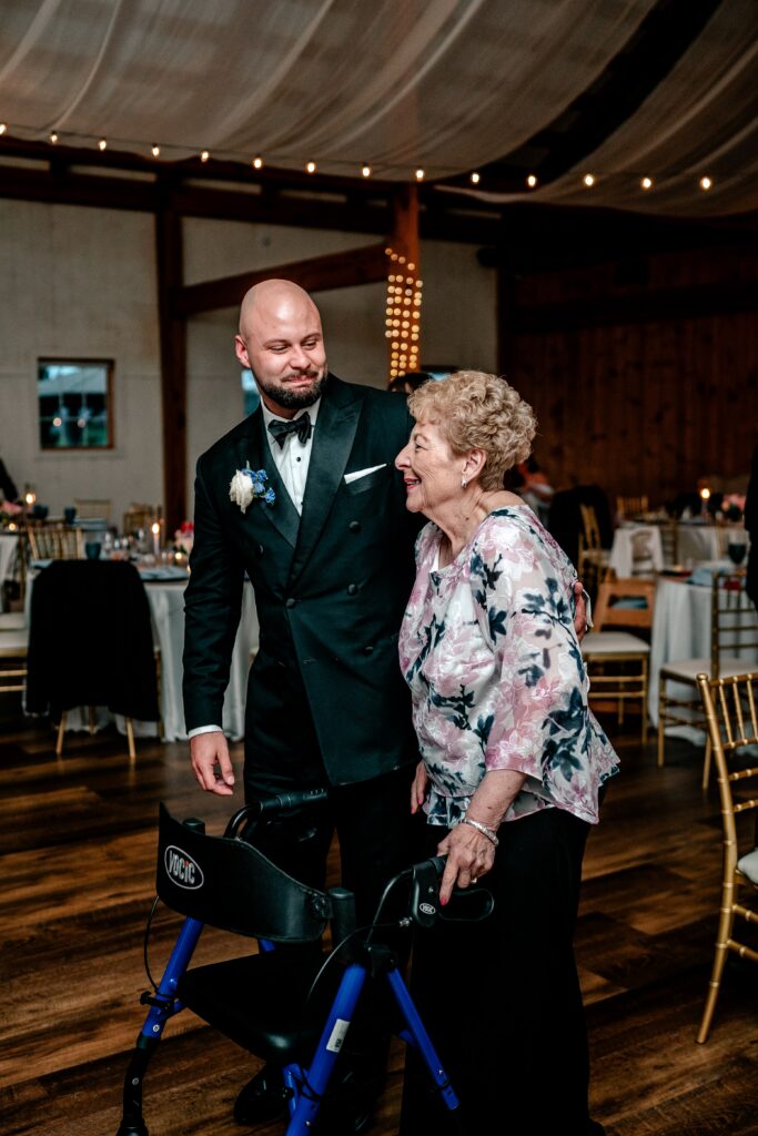 A groom smiling at his grandmother during his Shadow Creek wedding