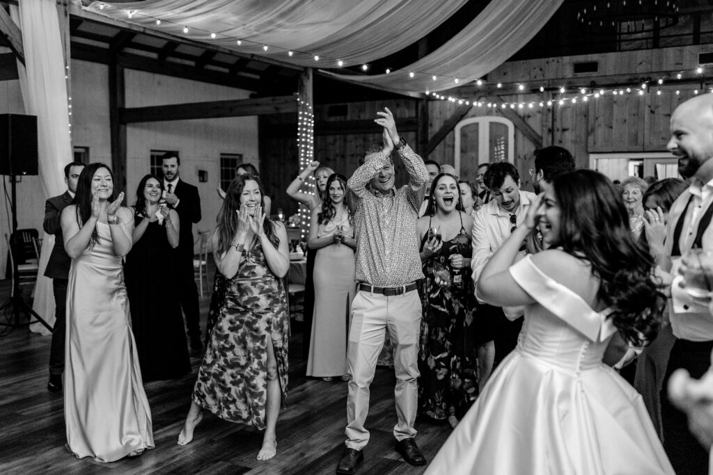 Wedding guests cheering for the bride and groom during a Loudoun County wedding