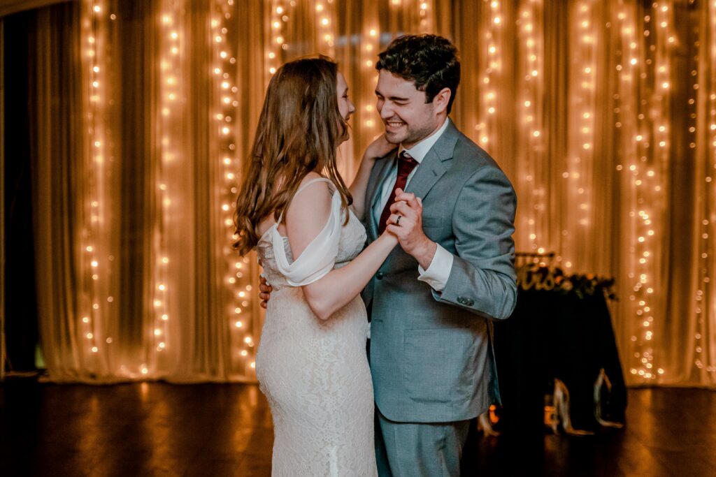 A groom laughs during their private last dance